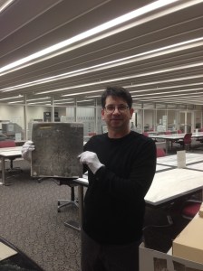 Me holding aerial photograph